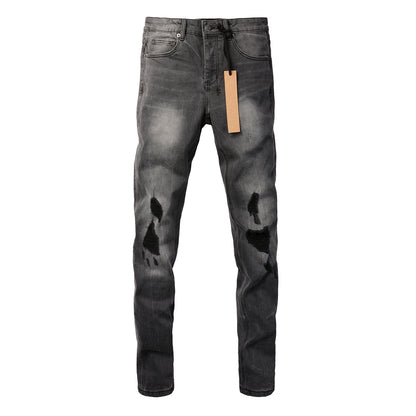 Urban Gray Ripped Jeans with Bold Black Graffiti Accents 3003
