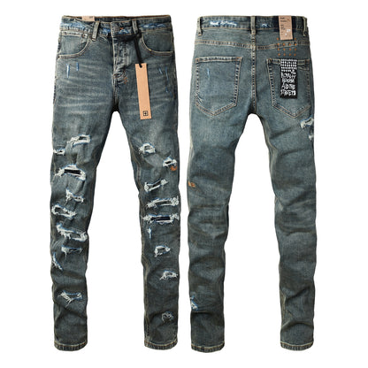 Vaqueros ajustados azul oscuro con rotos intensos para hombre con efecto desgastado extremo y parche gráfico en la espalda para estilo urbano 3049 